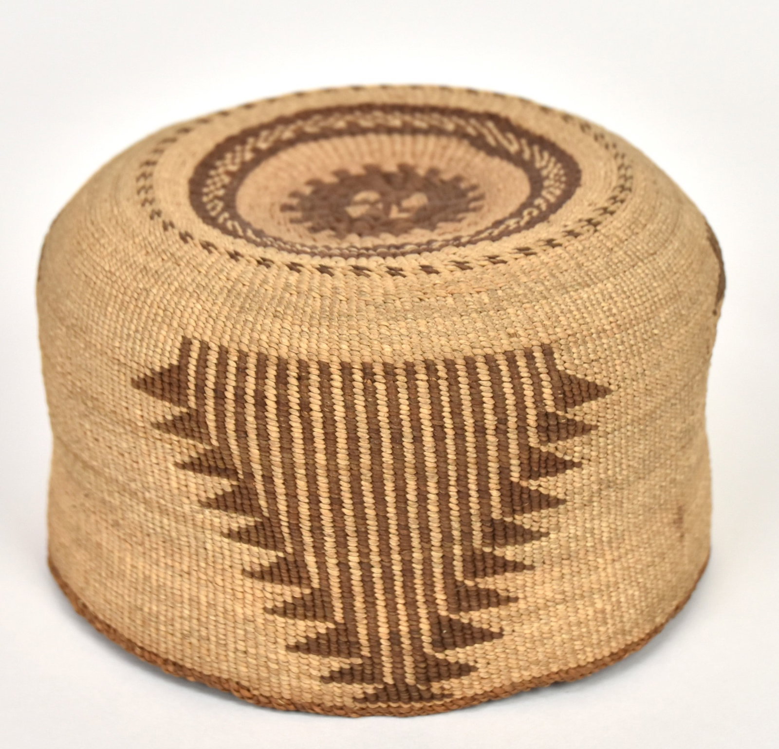 NW Coast Decorated Hat Basket: The Yurok, Karuk line along the Klamath River in NW California. Decorated on sides and base, early 20th century, 6 1/2" diameter x 4 1/4" high. Condition break at lip, VG-
