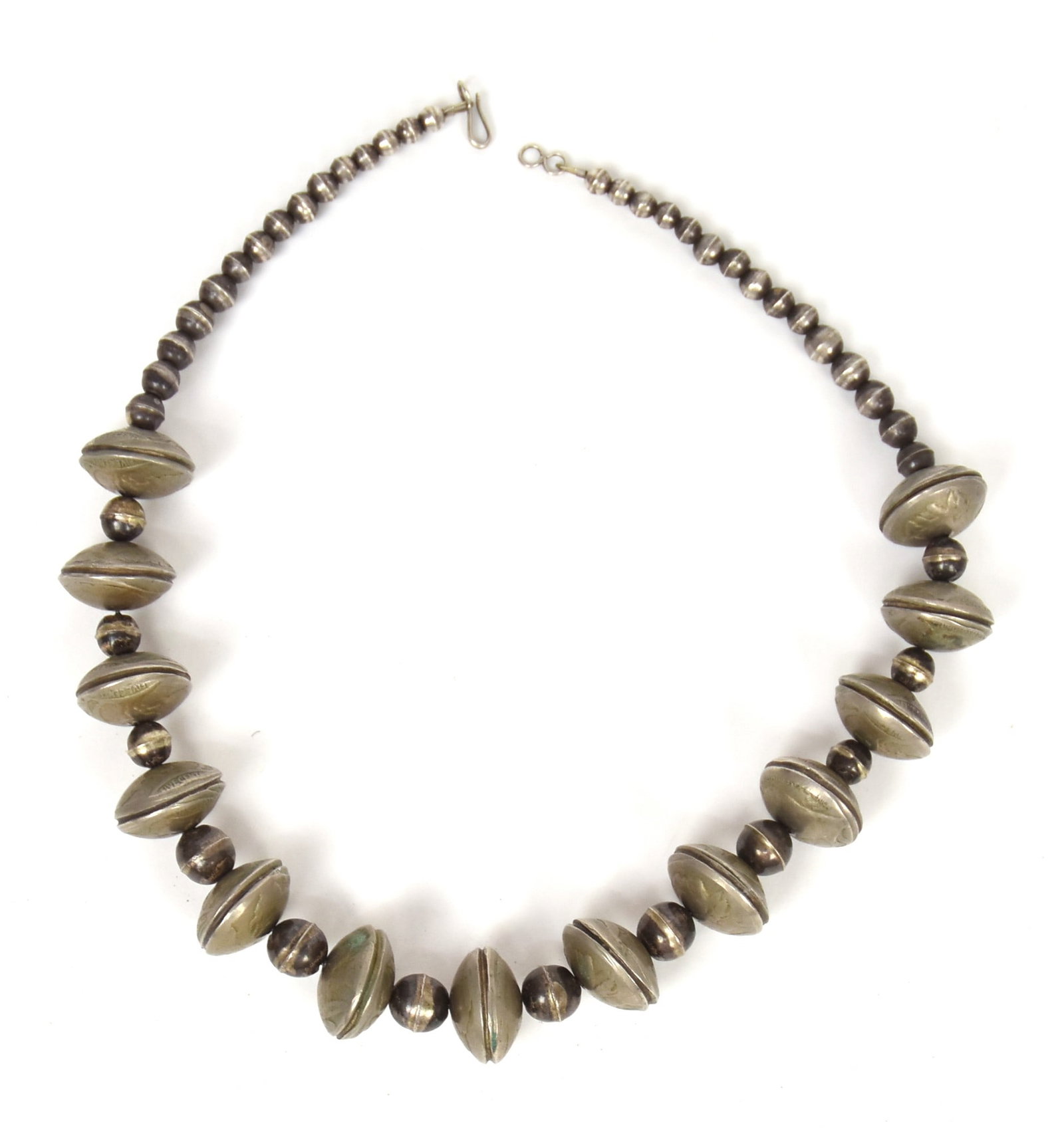 Navajo Native American Buffalo Nickle & Silver Necklace: Made with 26 nickles and 42 silver bead spacers, circa 1930-40s, 17 1/2" long. Condition Fine.