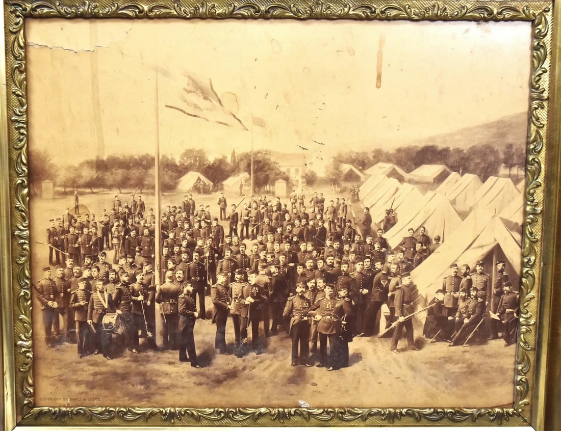 Troy Citizens Corps Albumen Photograph: Circa 1870, showing tent encampment with circa 80 officers, many armed with two flag poles one with U.S. and other with Troy Citizens Corps, Troy New York in original gilt Victorian frame, 20 x 14", f