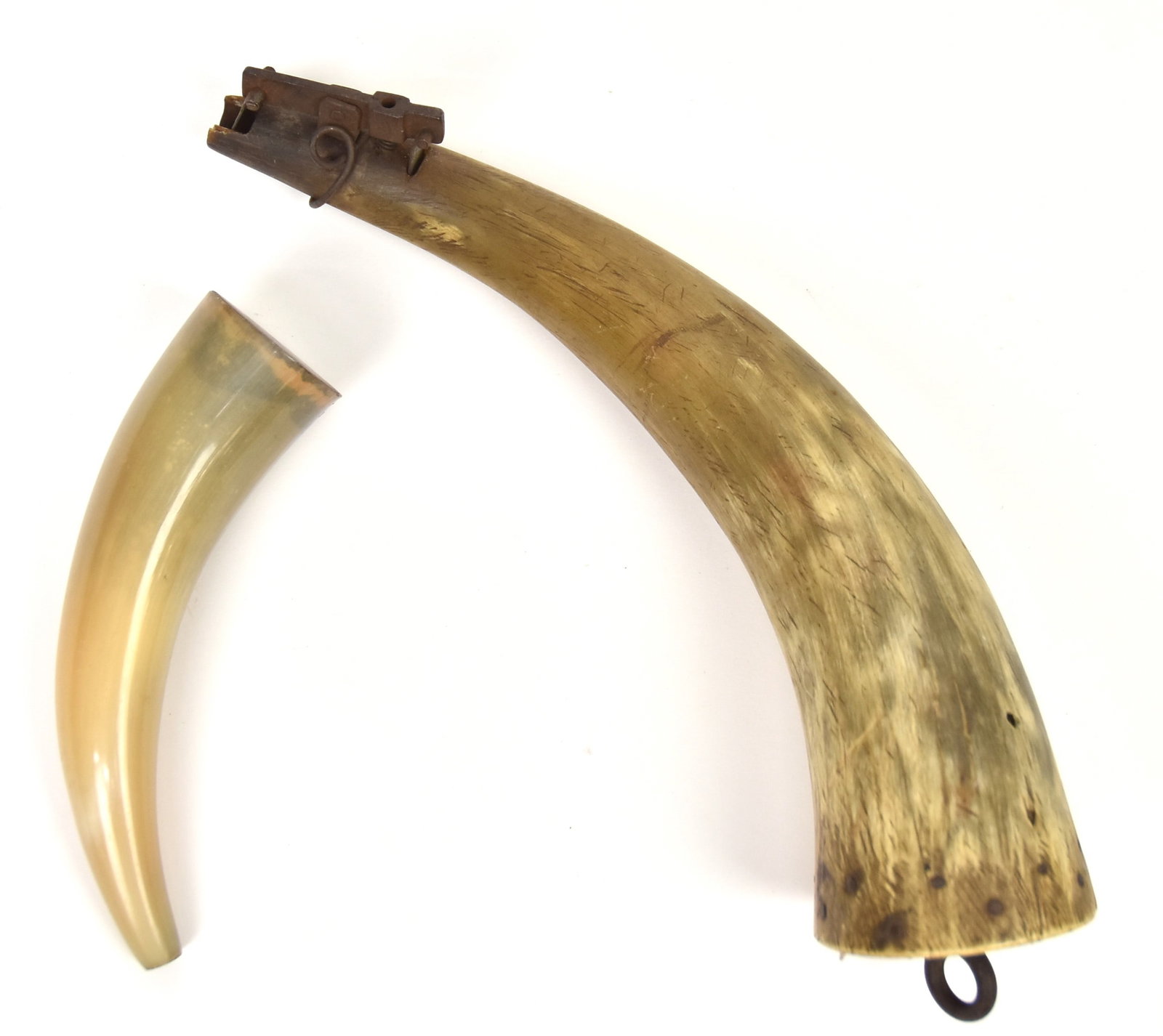 Two Powder Horns: Larger is old with nice patina, 10 1/2" long; and newer example 6" long. Condition Both VG.