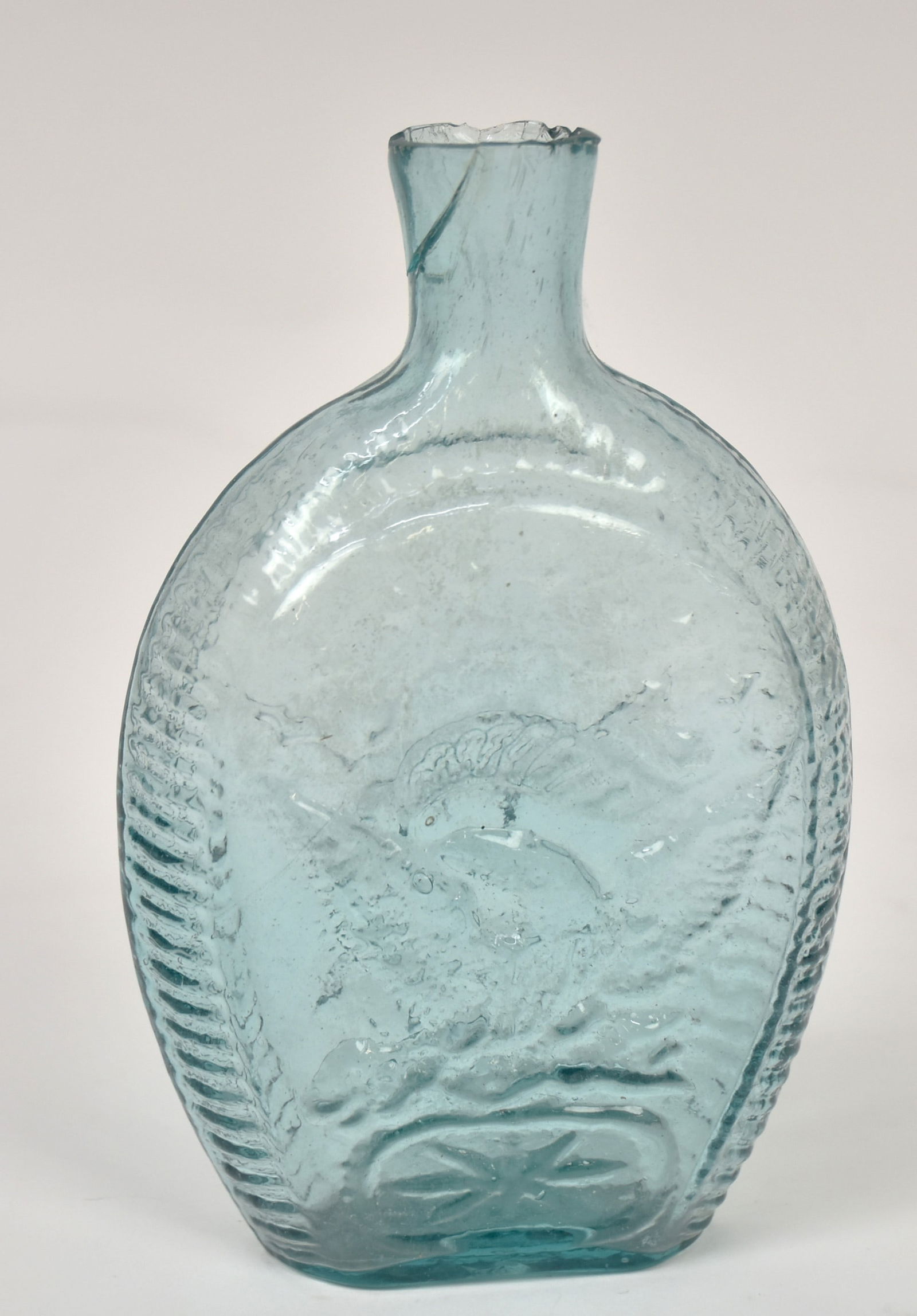 Early Blown Eagle Flask: Aqua, flat double sided with spread winged eagle, clutching ribbon banner in beak and arrows and laurel branch in talons with 14 stars arched above, oval below with 8-pointed star, ribbed shoulders an