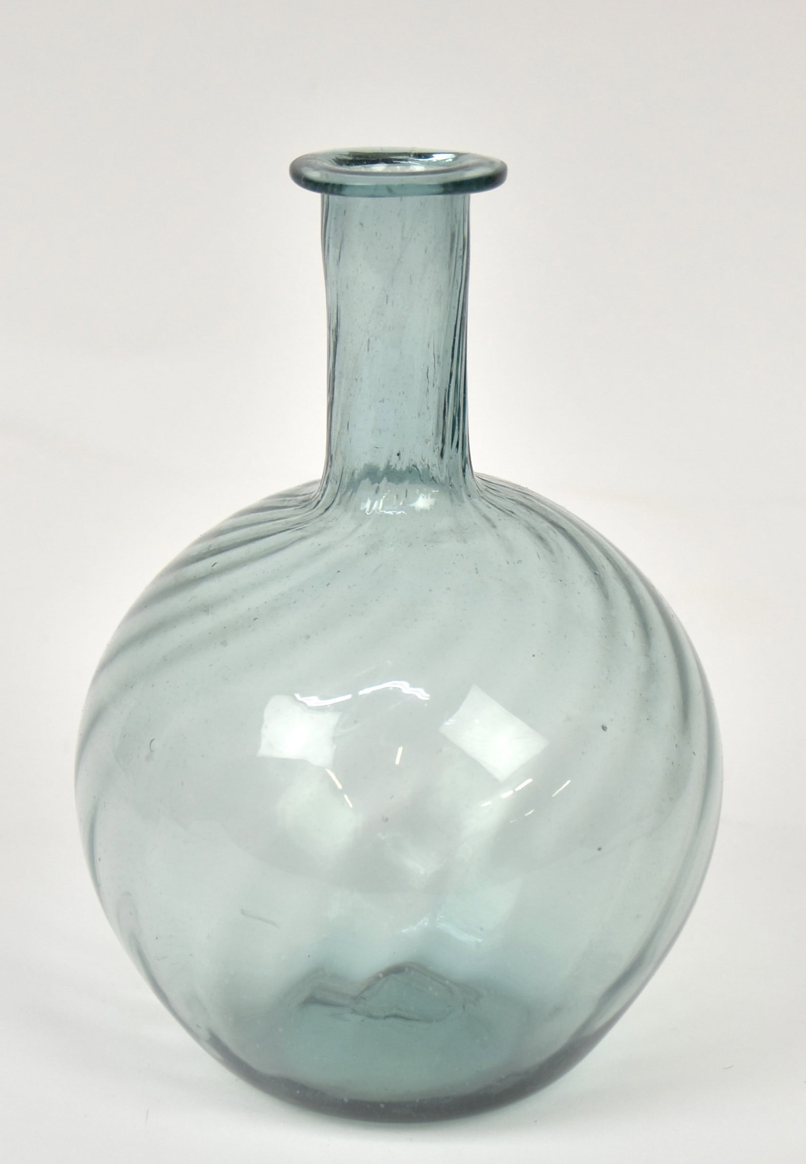 Aqua Zanesville Type Swirl Ribbed Bottle: Spherical form with 21 ribs, flared lid and snap pontil, 5 3/4" diameter x 8" high. Condition Fine.