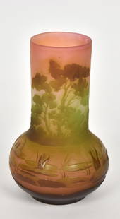 Galle cameo scenic cabinet vase: Continuous scene of a river bountiful with water lilies. Summer foliaged trees on the far bank. 5 7/8”T. Cameo signature. Inspiring view. Very good condition.