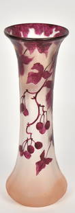 Legras cameo enamel vase, wild grape vine: Cascading the rim about a water flow textured backdrop. 10 1/2&rdquo;T. Cameo signature. Enameled France below the base. Very good condition.