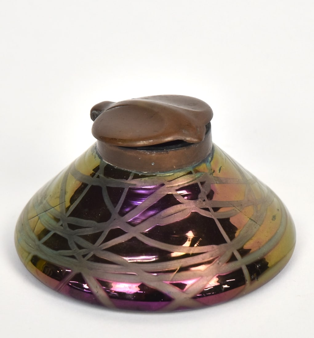 Kralik Loetz Type Art Glass Inkwell: Kralik Banded, Iridescent glass, original brass lid with original patina, 4" diameter x 2" high. Condition lacking interior glass well, else VG.