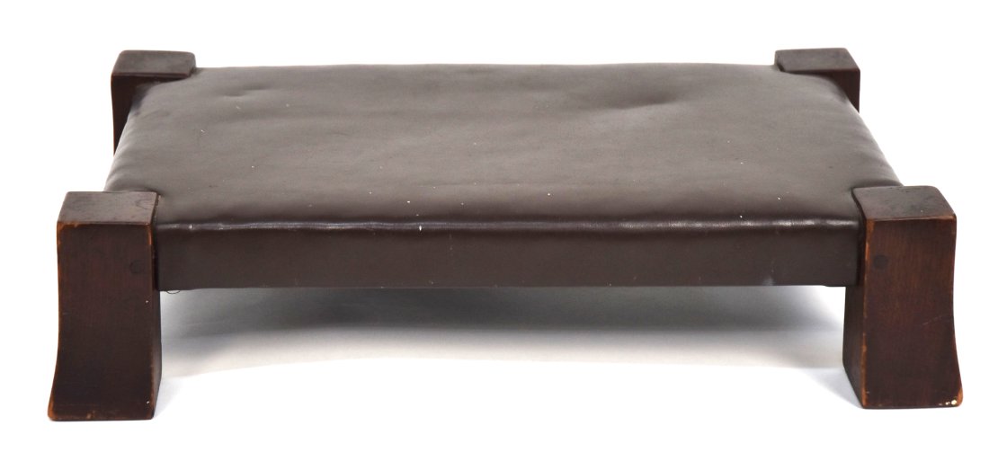 Gustav Stickley Flared Leg Footstool: Mahogany with pinned construction. Newer leather, original finish. 19 x 12x 4 1/2.