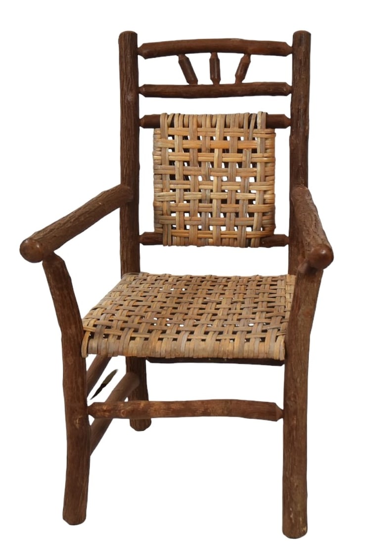 Contemporary Old Hickory Shelbyville, IN Armchair: With bent front posts and hickory caned seat and back. 40" H x 24" W x 25" D. Signed with metal tag. Cood condition.