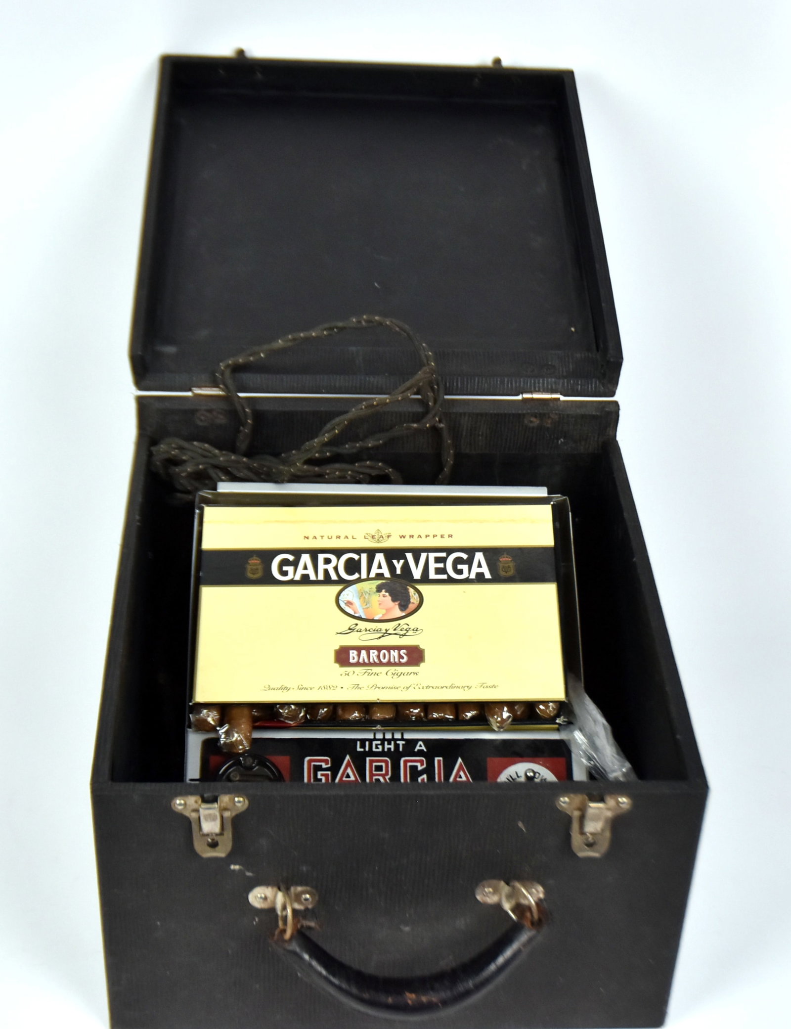 Garcia Vega Cigar Counter Display With Lighter: 7 x 8". Original carrying case. Good condition.