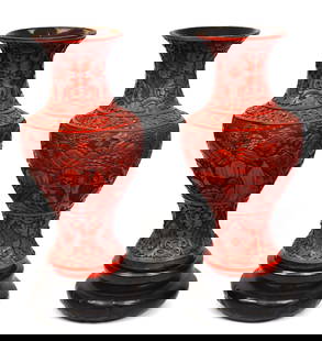Pair Early Chinese Cinnabar Vases: Circa 1800-1850, beautifully carved baluster form with scenes of scholars and students in garden setting, 6" diameter x 12 1/2" high, includes black glazed ceramic bases, 6" diameter x 3" high.