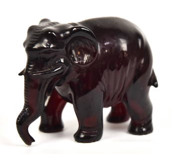 Chinese Amber Carved Elephant: Fine Cherry colored amber of standing elephant, 2 3/4 x 1 1/2 x 2 1/4" high. Condition Fine.