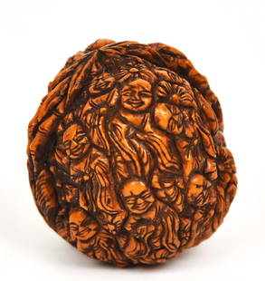 Finely Detailed Carved Japanese Walnut: Landscape with bamboo and figures, fine patina, 1 1/4" diameter x 1 1/2" high. Condition Fine.