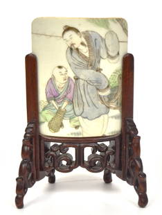 Chinese Porcelain Table screen: 19th century, curved form with two polychrome painted figures fishing, mounted in a finely carved teak stand, 3 x 4 x 5 3/4" high. Condition Fine.