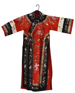 Chinese Embroidered Silk Ladies Robe: Circa 1920-30 in red and black ground with polychrome embroidered flowers and butterflies on exterior and interior, 55"