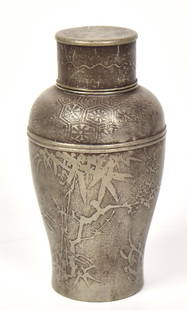 Signed Chinese Pewter Tea Caddy: Baluster form with shallow relief cast bamboo and flowers, exterior and interior lid, marked on base by maker, 2 1/4" diameter x 5" high. Condition Fine.