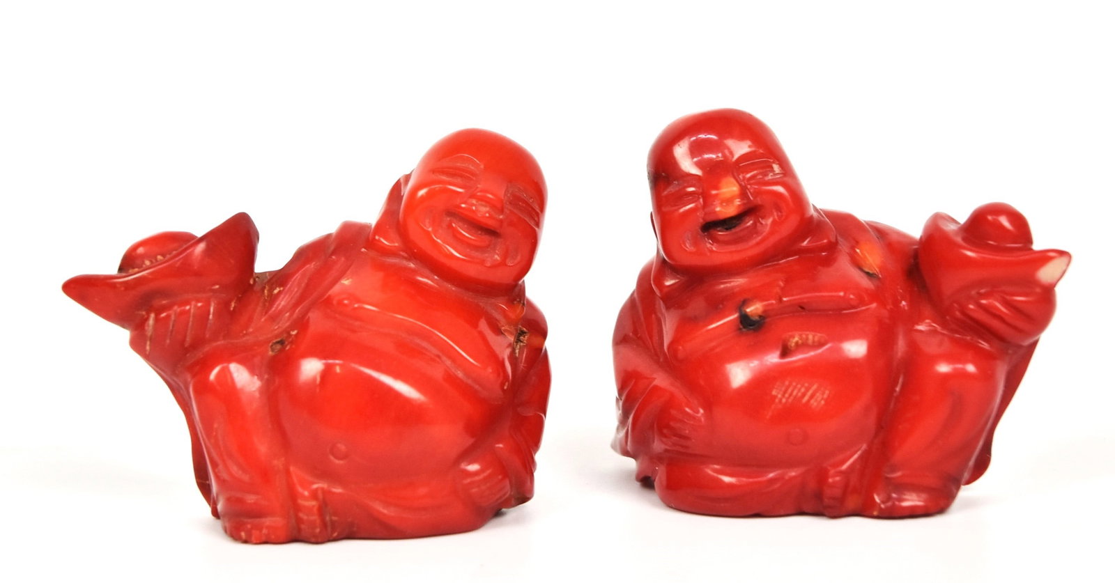 Two Chinese Carved Coral Buddha: Red coral of seated Buddha holding fruit in bowl, 2 14 x 1 x 1 7/8 & 1 ½" high. Condition both Fine.
