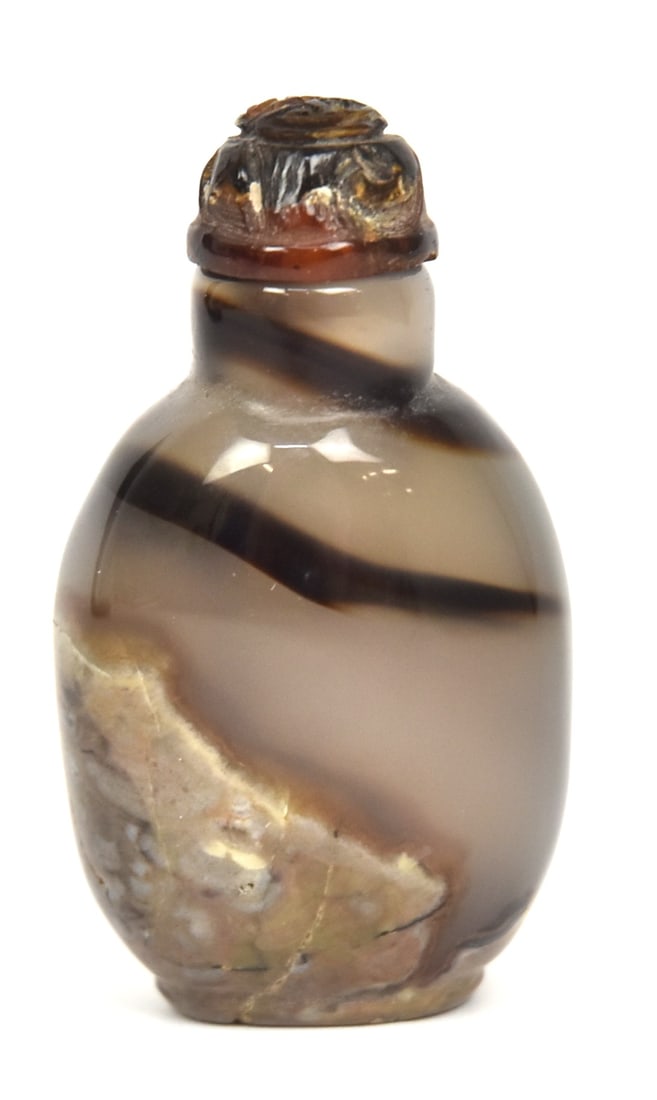 Chinese Agate & Amber Snuff Bottle: Lovely veined gray to purple agate with carved red amber lid with bone spoon, 2" high. Condition Fine.