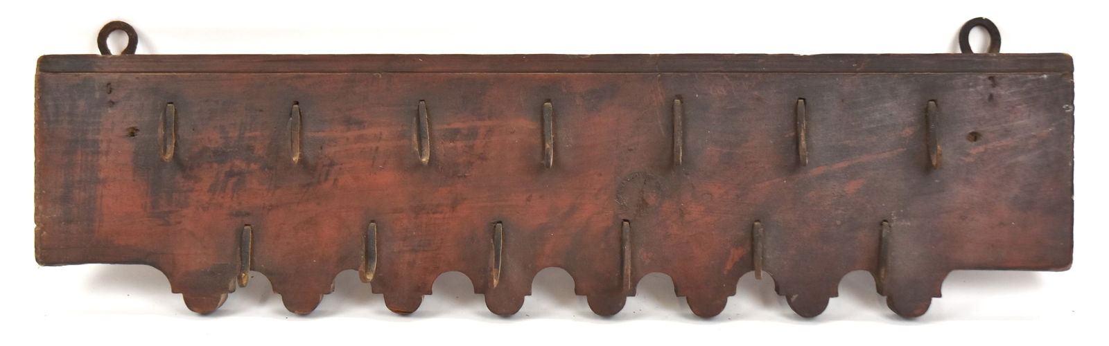 Early Hanging Game Rack with Old Red: With thirteen wrought iron hooks and cut-outs in old red paint. 8 1/2" H x 33" Long. Good condition.