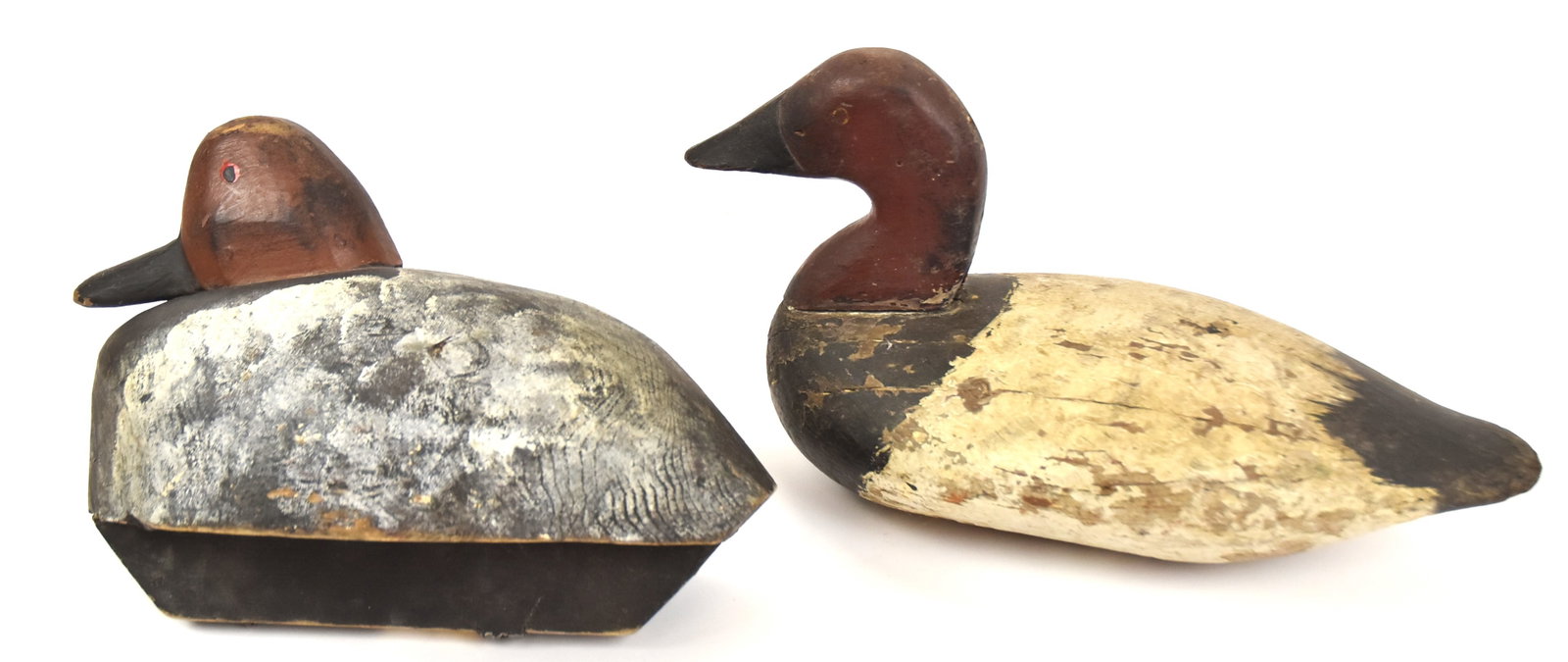 Two Wooden Duck Decoys: Both with old paint. Largest 7" H x 13" Long. Both in good condition.