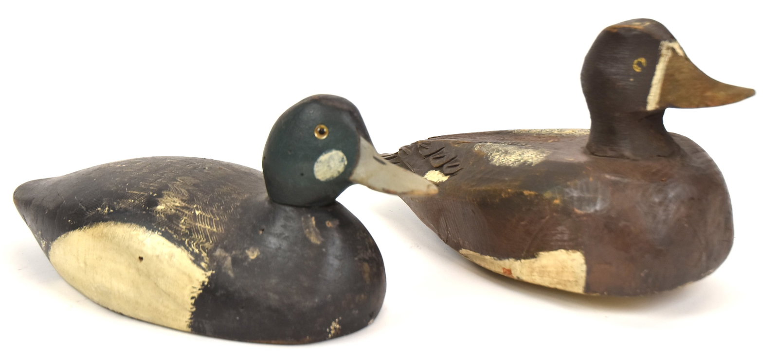 Two Wooden Duck Decoys: Both with old paint. Largest 6 1/4" H x 11" Long. Both good condition.
