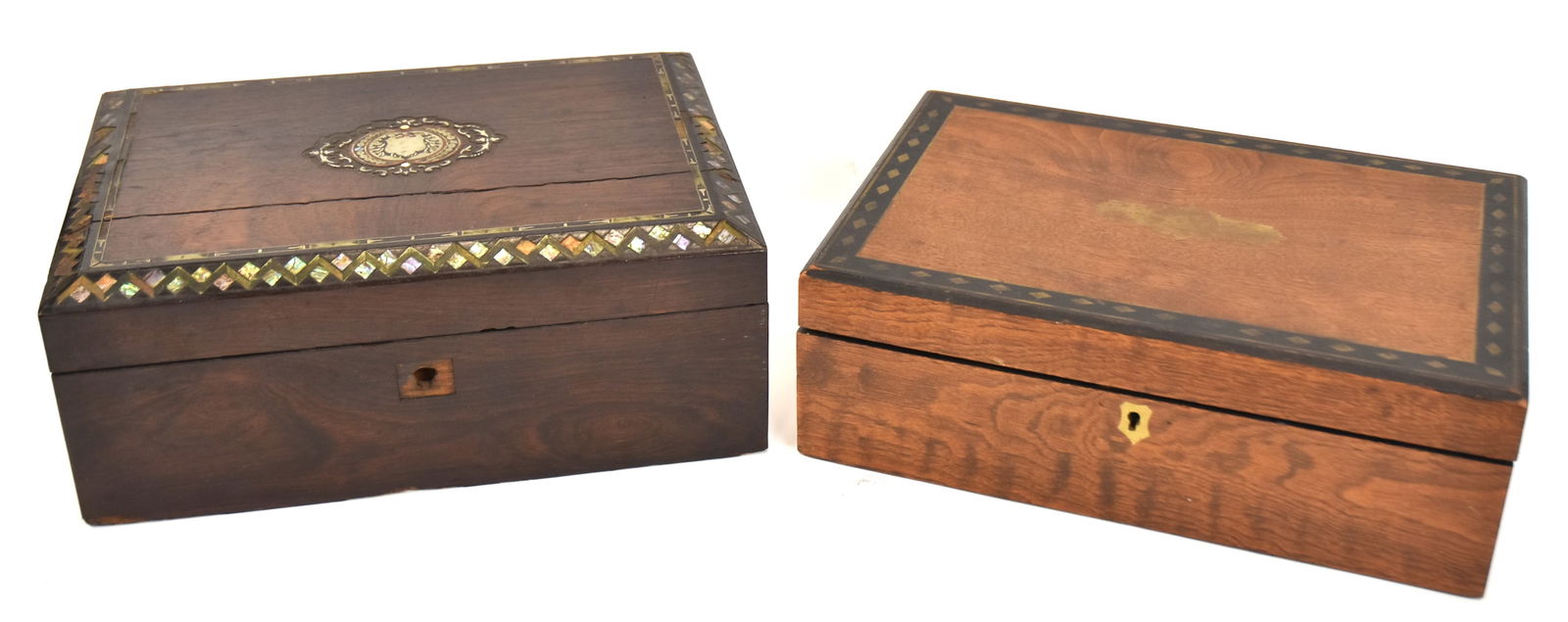 Two Fine Lap Desks: First rosewood with mother-of-pearl in silver inlay on edge of top and silver inlay center medallion, lift lid with two lidded compartments. 5" H x 13" W x 9 1/4" D. Some m.o.p. missing and two rosewo