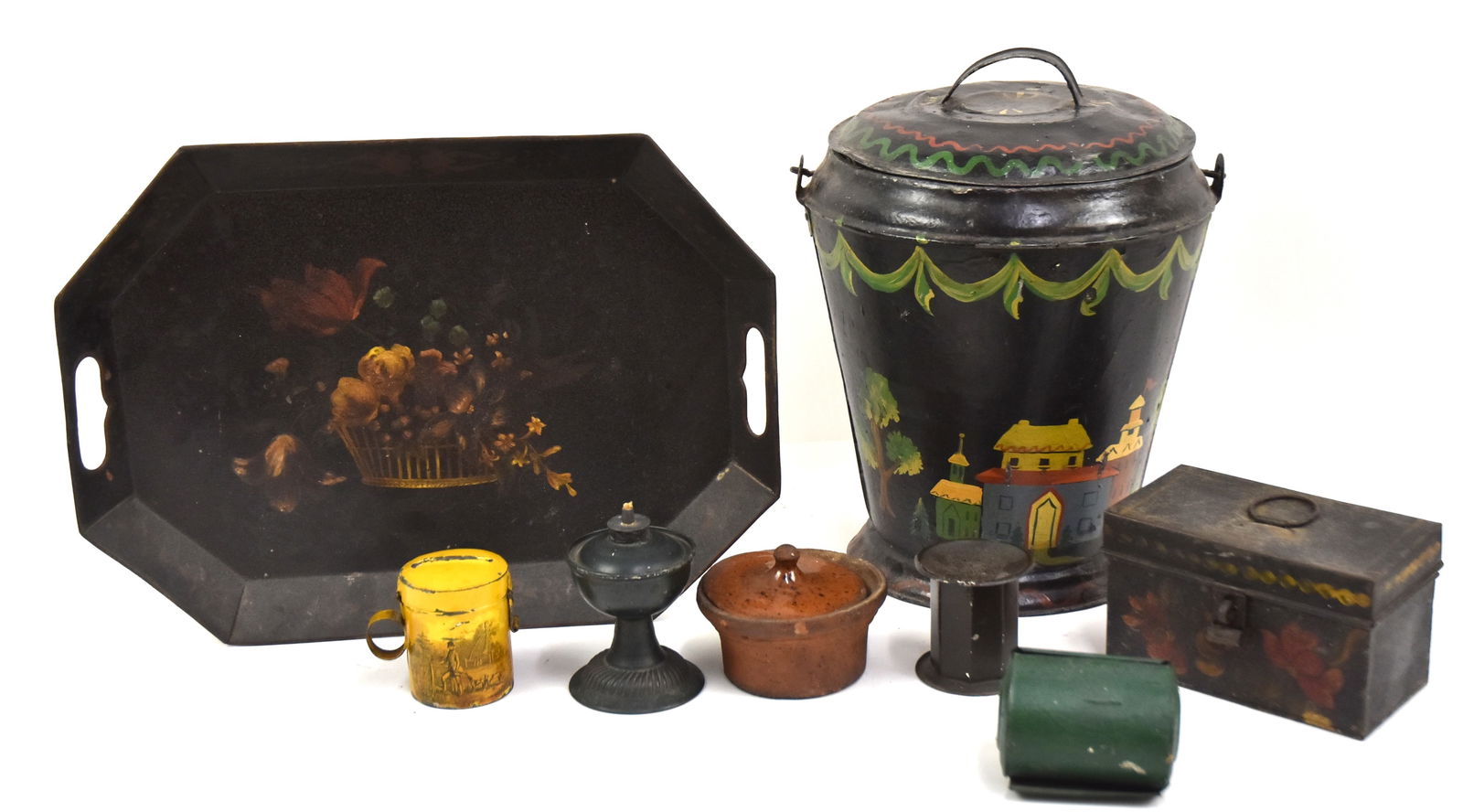 Early Tinware, Toleware, Plus: Early tin match holder in old green, tin oil lamp in old green, early toleware kitchen money bank with scenes, redware dish with lid, toleware decorated tray, 16" x 12". Plus toleware box and tin shak
