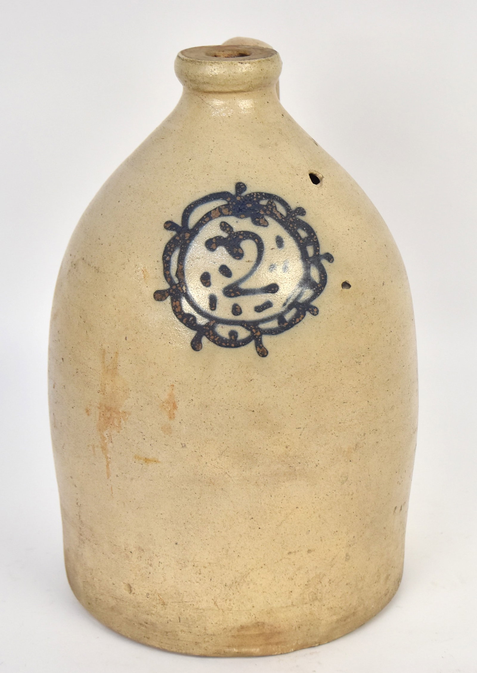 Blue Decorated Stoneware Jug: 2 gallon jug. Has firing hole with line near top. 13"h.
