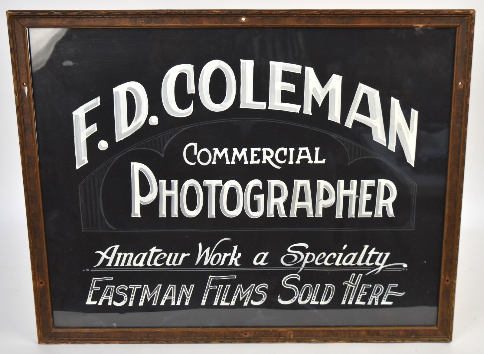 F.D. Coleman Photographer Trade Sign: Hand painted sign reads F.D. Coleman Commercial Photographer, Amateur work a specialty, Eastman Films sold here. Circa 1920. 21 1/2" x 27 1/2".