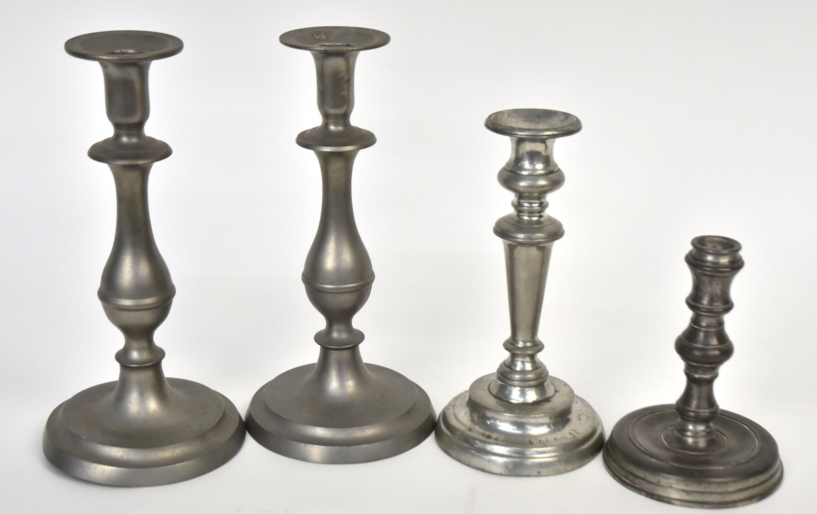 Pewter Candles Sticks Plus: One pair a single , all have push-ups. One marked Newberry Court by Towle. Tallest is 10"h.