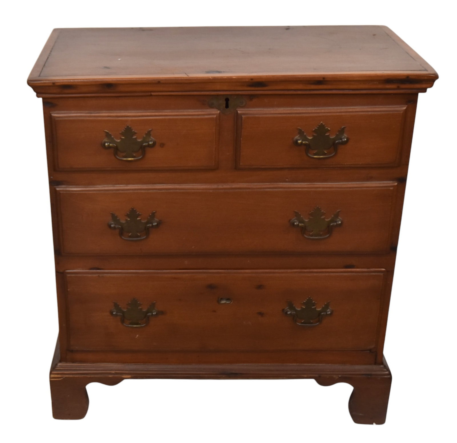 Scarce 19th Century Miniature Lift Top Blanket Chest: New England with 3 false drawers over 1 dovetailed drawer. Resting on original bracket base.24 x 23 x 13".