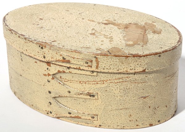 SHAKER 4-FINGER OVAL PANTRY BOX W/OLD PAINT: Nice old alligatored cream paint. Remnants of old paper on lid. Fine condition. 9" w x 3 1/2" h.