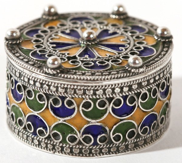 FANCY ENAMELED SILVER PILL BOX: Beautiful pill box which has five unidentified hallmarks. Good condition. 1" h x 1 1/2" diameter.