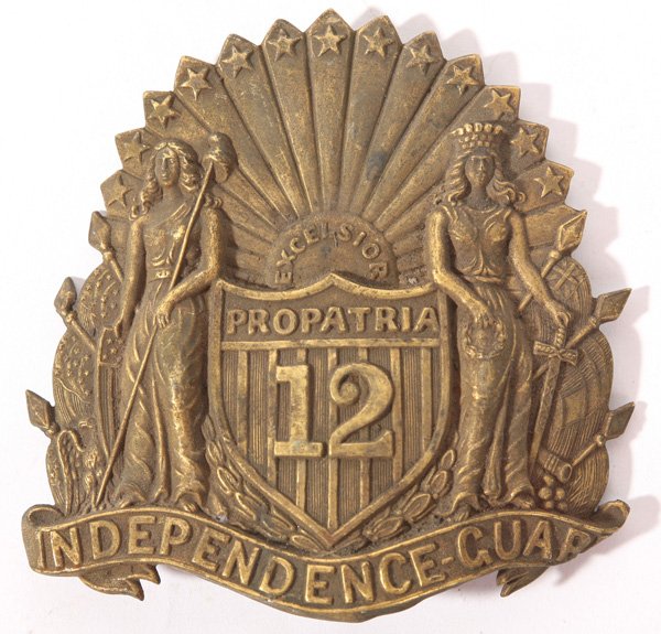 12TH N.Y. INFANTRY CIVIL WAR HAT BADGE: In stamped brass with original rear attachment loops. Very early Civil War era. Excellent condition. 4 1/4" x 4 1/2" high.