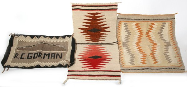 R.C. GORMAN NAVAJO WEAVING PLUS: Lot of three Navajo weavings including one signed in weaving, "R.C. Gorman" , listed American Indian artist (1932-2005). 16 1/2" x 23". Plus two other small weavings, 16" x 33" and 21" x 28". First fi