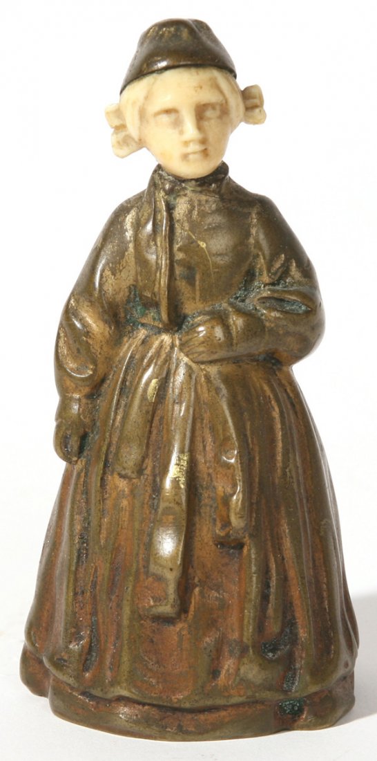 PETER TERESZCZUK (AUSTRIAN) FIGURAL BRONZE BELL: Peter Tereszczuk (Austrian, 1875-1963) figural bronze bell of girl with ivory head. Signed, "P. Tereszczuk" with AR foundry mark. Good condition. 4" h.