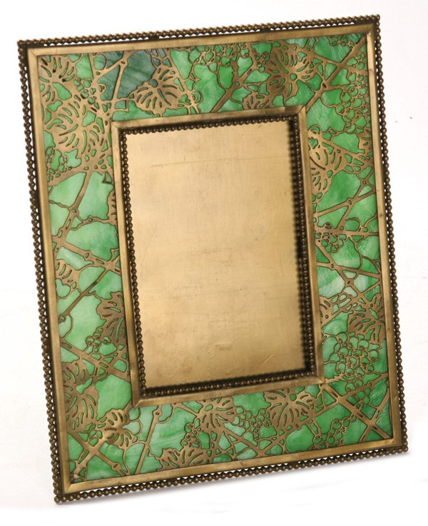 TIFFANY STUDIOS GRAPEVINE PICTURE FRAME: Signed Tiffany Studios New York. Tiny 3/4" line in bottom glass, otherwise fine condition. 9 1/2" x 8".