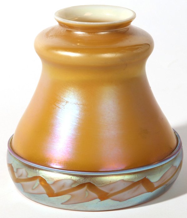 STEUBEN INTERSIA ART GLASS SHADE: Covered in a caramel brown aurene, border with a decorative intersia band. Signed with silver "Fleur-de-lis". Good condition. 5 1/2" h x 5 1/2" w.