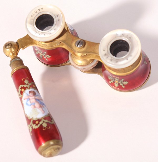 PR. OF FRENCH ENAMELED OPERA GLASSES: Depicting ladies on glasses and cherub on extending handle. Marked, "La Reine, Paris" on mother-of-pearl. Good condition. 6" h x 4" w.