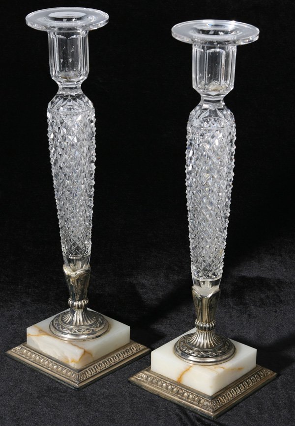 LG. PR. OF CUT GLASS PAIRPOINT CANDLESTICKS: Pr. of 15 1/4" candlesticks with heavily cut stems resting on a marble and metal base. Signed, "Pairpoint" on base. Good condition.