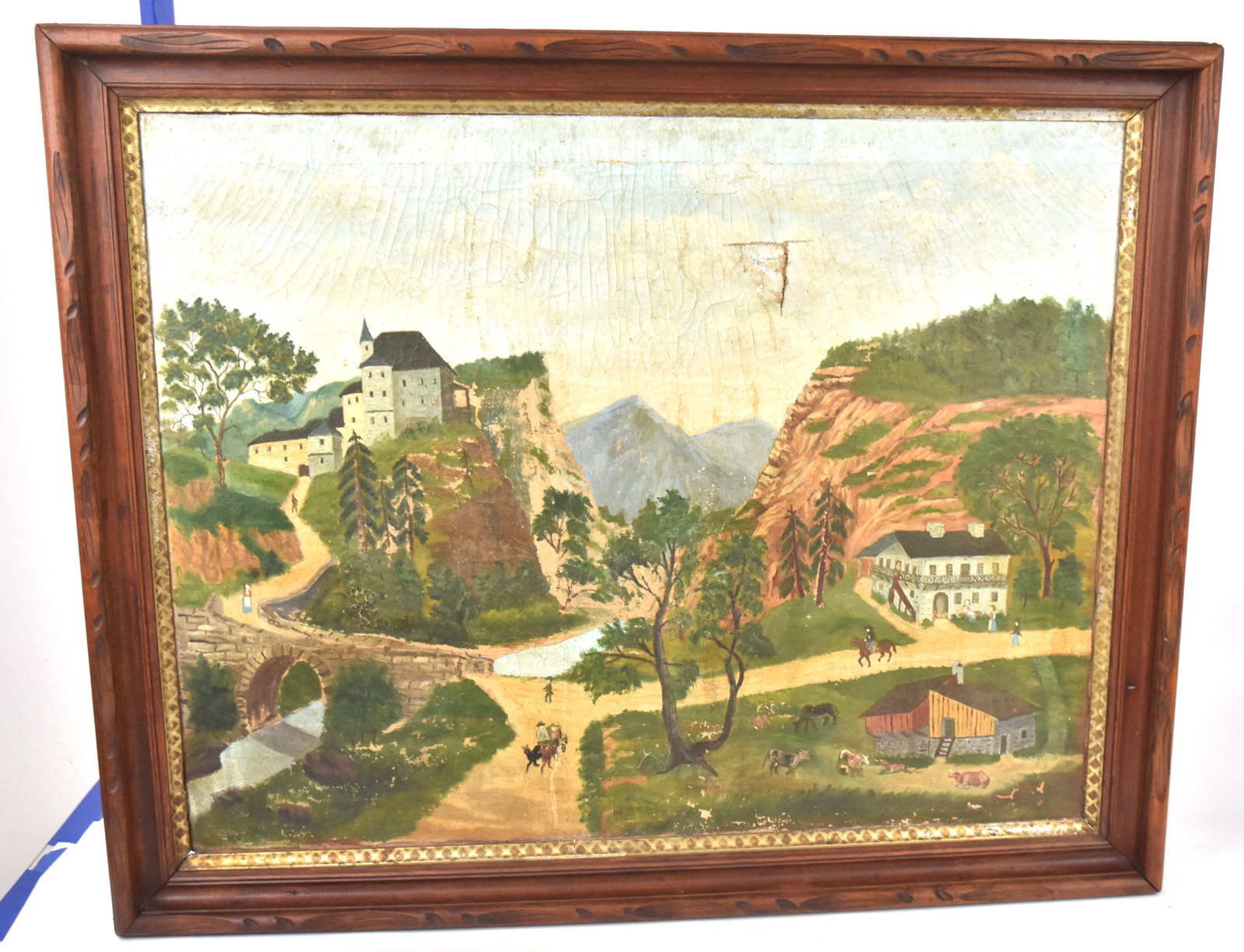 Folk Art Painting of Farm Scene: With homes, barns, farm animals, and horsemen. 21 1/2" h. x 27 1/2 " w. , frame 26" h. x 32" w. Some craquelure and tear upper right; otherwise as found condition.