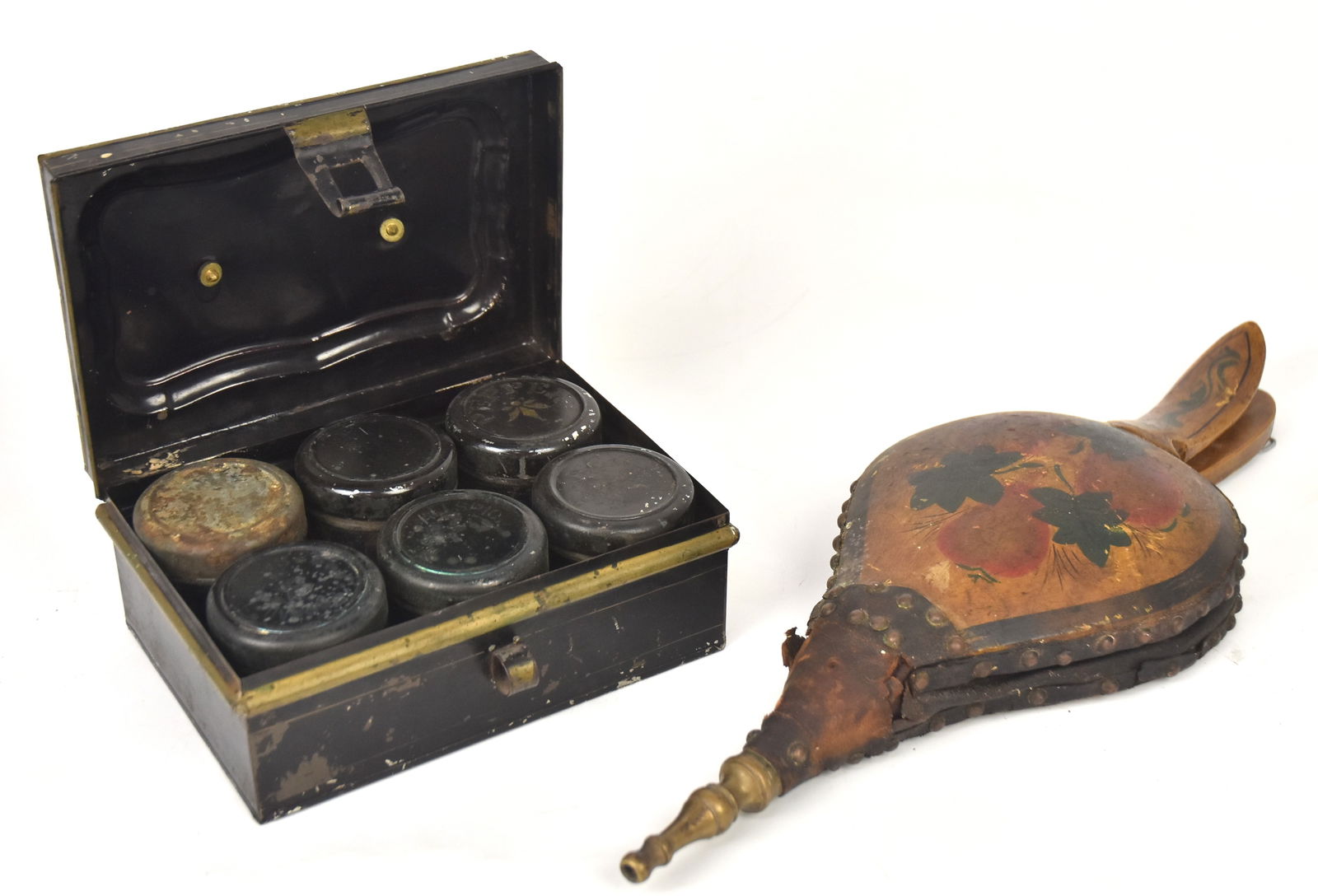 Early Paint Decorated Bellows, Plus: Pennsylvania paint decorated bellowswith brass stem. 17" x 6 1/2". Leather split to one side. Plus a 6 tin spice box in container with brass handle. 4" H x 7 1/2" W x 6" D. One spice tin top lacking p