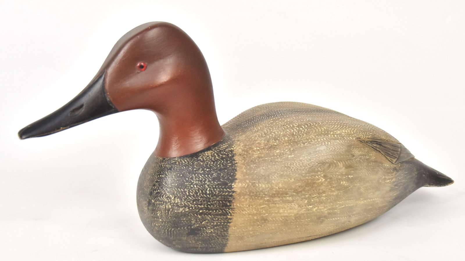 Fred Destri, Ill. Wooden Duck Decoy: Stamped, "Destri" with finely detailed painted feathers. 8 3/4" H x 17" W. x 6" D. Good condition.