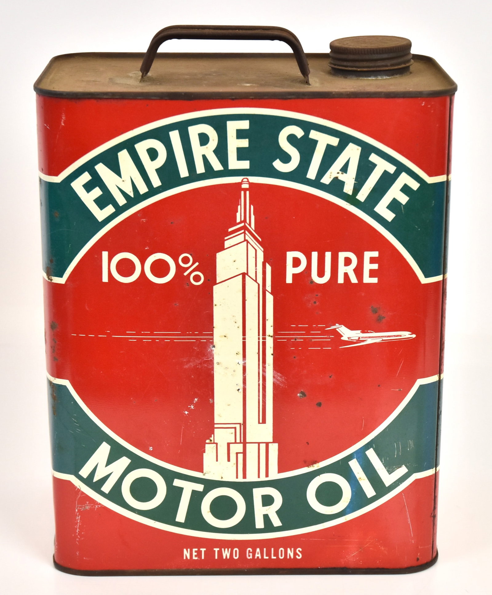 Empire State Motor Oil Can: 2 Gallon with Empire State building and airplane. 11"H x 9"W. Original cap. Some paint chips overall good condition.