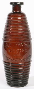 AMBER OLD SAGHEN BITTERS AND WIGWAM TONIC BOTTLE: Ribbed barrel form with embossed name on side. Fine condition. 9" h.