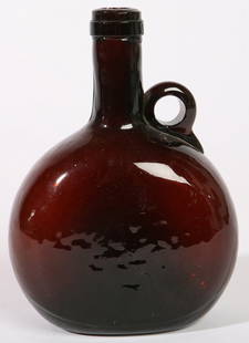 DEEP AMBER HANDLED FLASK: Pilgrim type with applied "C" scroll handle flat sided. Bruise on neck near handle. 7 3/4" h.