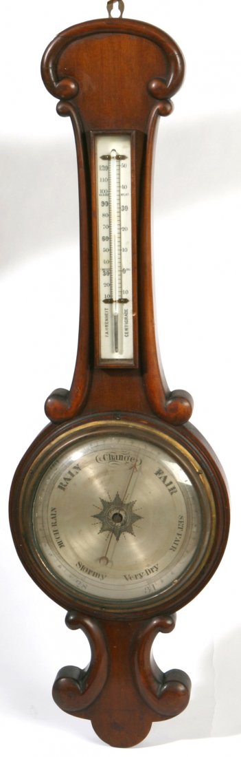 EARLY MAHOGANY BAROMETER: In original old finish with carved scroll work case, silvered brass dial and thermometer with both "Fahrenheit" and "Centigrade". Circa 1850. Minor crack in scroll work, otherwise fine condition. 32"