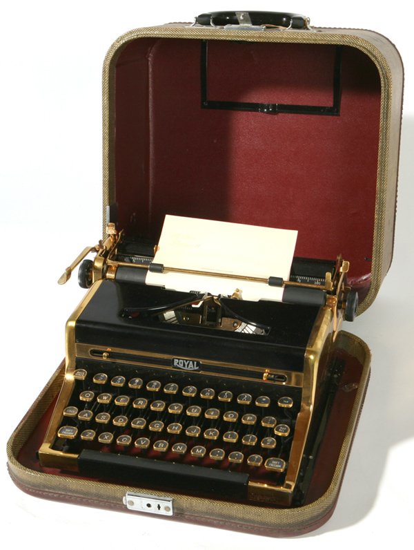 RARE GOLD PLATED PRESENTATION ROYAL TYPEWRITER: Presented to "Dick Barnett & his Pest Control Co. by the Dayton Biltmore Hotel" in Dayton, Ohio. Inscribed on each side of typewriter and on case. Excellent condition. Case 13" x 13" x 7".