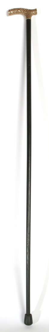 14K GOLD HEADED CANE: With all over floral chasing, on tapered ebony shaft. Hallmarked. 36" total length.
