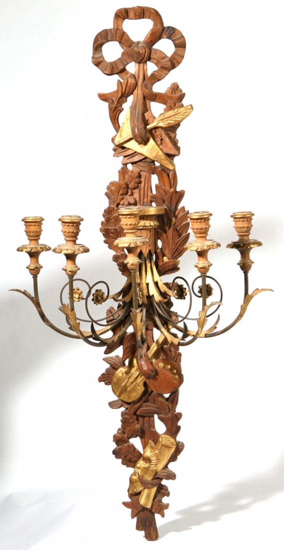 CARVED & GILT WOOD WALL SCONCE: In Italian rococco style with vining oak and laurel leaves, musical instruments, and scroll with five candle arms and carved ribbon hanger. Fine condition. 43 1/2" long.