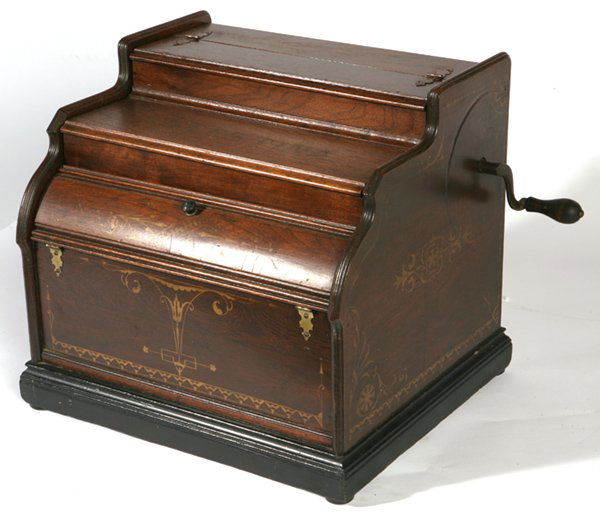 CELESTINA WOODEN ROLLER ORGAN: Nice original stenciling on walnut case. Appears to be in working order but no rolls. 14" h. x 15" w. x 13" d.