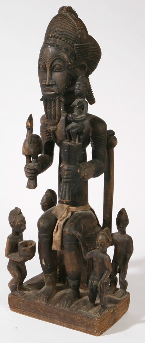 LG. AFRICAN TRIBAL CARVING: Of chief seated on throne and surrounded by smaller servants. Carved from single block of wood. Nice old dark patina. 8 1/2" x 10 1/2" x 31" h.